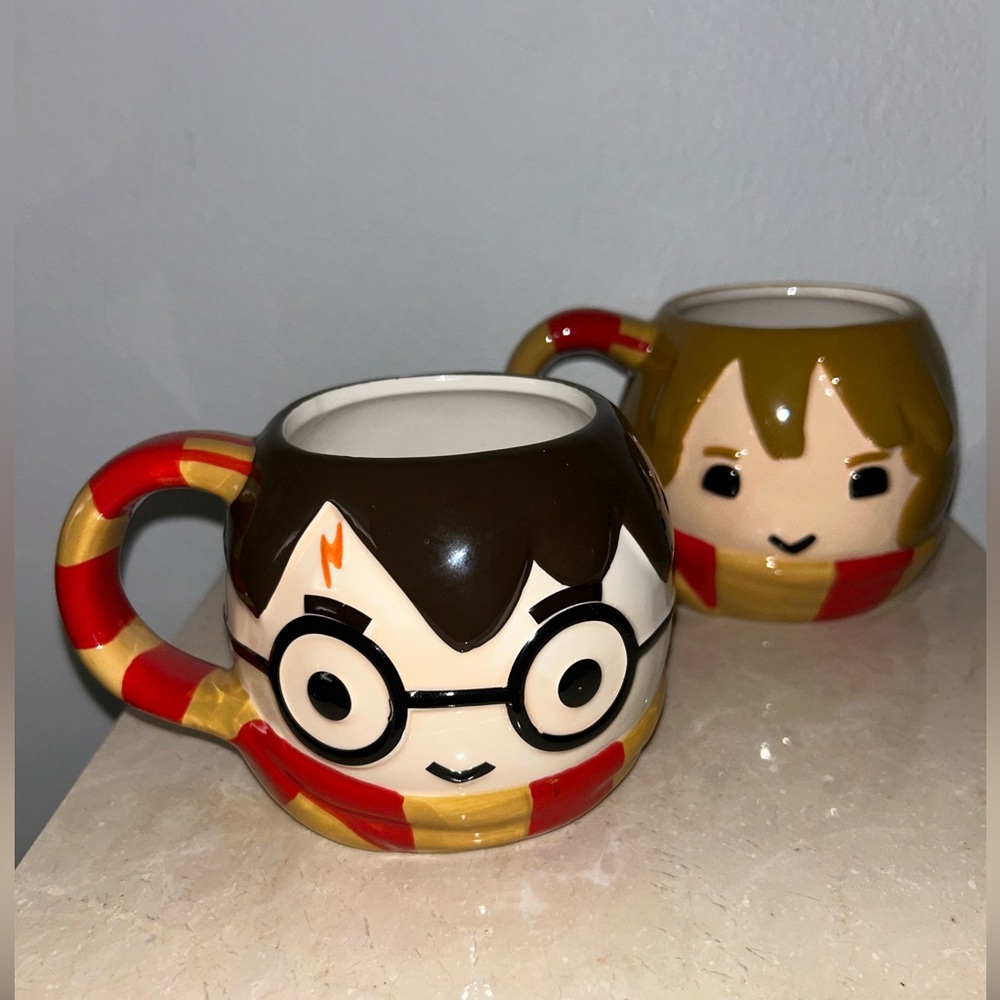 2 Warner Bros. Wizarding World. Harry Potter & Hermione mugs. 24oz